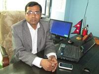 Chairman of Celltronic Telesolutions at his desk